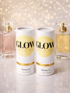 Luxury unboxing experience featuring custom paper tubes with premium gold foil branding.